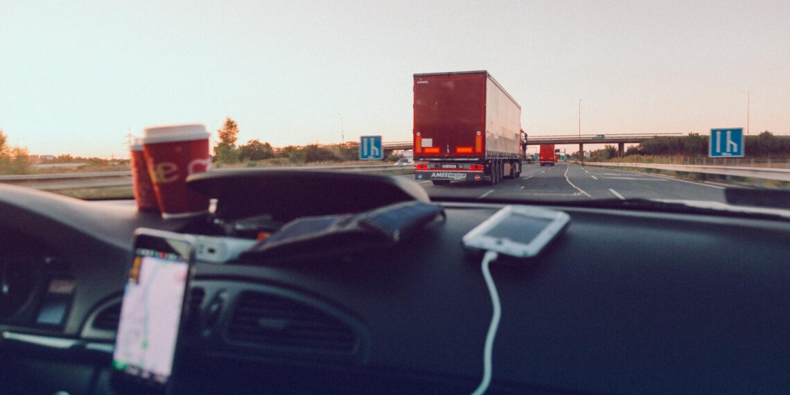 Experience the open road with a scenic drive, capturing the essence of freedom through the car windshield.