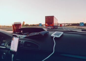 Experience the open road with a scenic drive, capturing the essence of freedom through the car windshield.